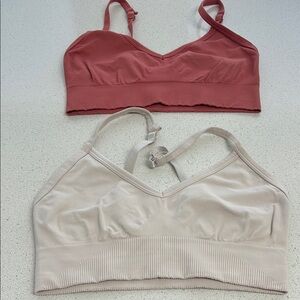 Lululemon sports bras between four and a six Pink and Cream $25.00 each